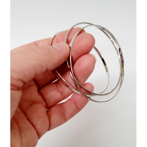 94 - A STUNNING TRIO OF 18CT WHITE GOLD BANGLE BRACLETS, each hallmarked; 18ct white gold. 750. 6cm wide.