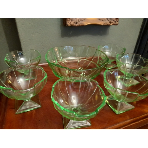 263 - A COLLECTION OF ART DECO GREEN GLASSWARE TO INCLUDE, dessert/punch bowl, along with six small desser... 