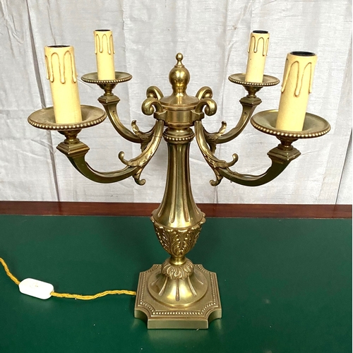 173 - A DECORATIVE FOUR BRANCH BRASS ORMOLU CANDLEABRA LAMP, the four branches with scroll design and bead... 