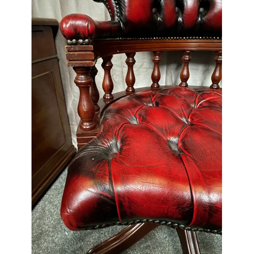 214 - AN EXCELLENT OXBLOOD RED LEATHER DESK/CAPTAINS CHAIR, with button back design to oxblood red leather... 