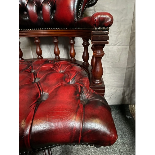 214 - AN EXCELLENT OXBLOOD RED LEATHER DESK/CAPTAINS CHAIR, with button back design to oxblood red leather... 