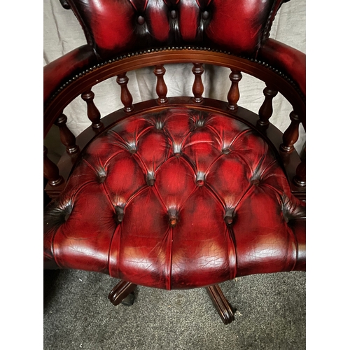 214 - AN EXCELLENT OXBLOOD RED LEATHER DESK/CAPTAINS CHAIR, with button back design to oxblood red leather... 