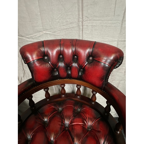 214 - AN EXCELLENT OXBLOOD RED LEATHER DESK/CAPTAINS CHAIR, with button back design to oxblood red leather... 