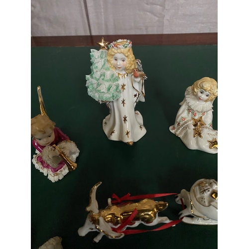 275 - A COLLECTION OF FIVE IRISH DRESDEN PORCELAIN CHRISTMAS FIGURINES, to include Angel Gloria, each with... 