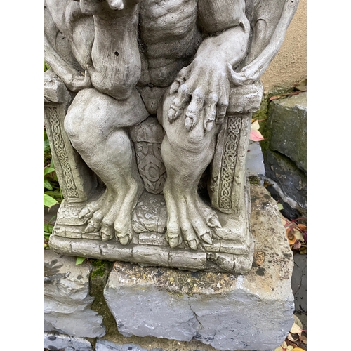 280 - A STONE GARDEN FIGURE IN THE FORM OF SEATED GARGOYLE, dimensions: 49cm high