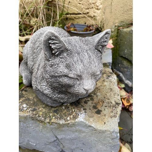 282 - A STONE GARDEN FIGURE IN THE FORM OF SLEEPING CAT, dimensions: 34cm wide approx.