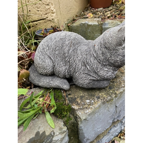 282 - A STONE GARDEN FIGURE IN THE FORM OF SLEEPING CAT, dimensions: 34cm wide approx.