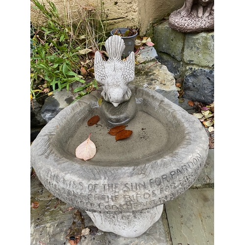 284 - A STONE GARDEN BIRDBATH, with bird to top, engraved to front, on support. Dimensions: 36cm high appr... 