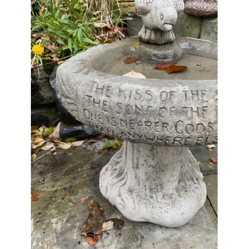 284 - A STONE GARDEN BIRDBATH, with bird to top, engraved to front, on support. Dimensions: 36cm high appr... 