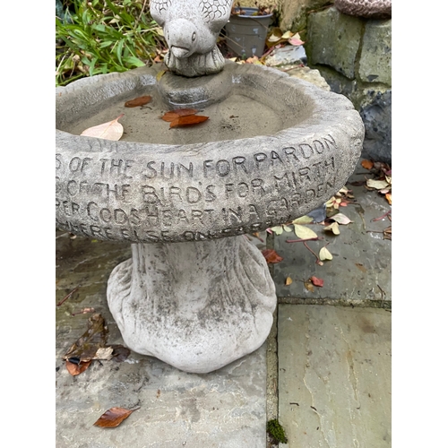 284 - A STONE GARDEN BIRDBATH, with bird to top, engraved to front, on support. Dimensions: 36cm high appr... 