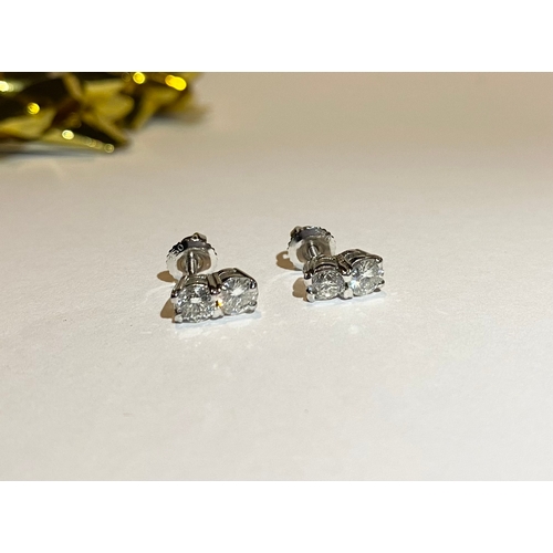 32 - AN EXQUISITE PAIR OF TWO STONE DIAMOND STUD EARRINGS, with 18ct white gold safety backs. Diamond wei... 