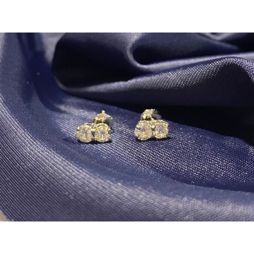 32 - AN EXQUISITE PAIR OF TWO STONE DIAMOND STUD EARRINGS, with 18ct white gold safety backs. Diamond wei... 