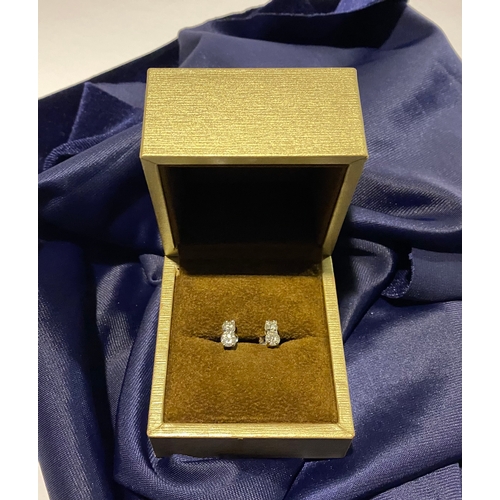 32 - AN EXQUISITE PAIR OF TWO STONE DIAMOND STUD EARRINGS, with 18ct white gold safety backs. Diamond wei... 