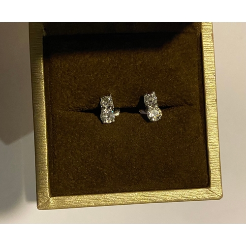 32 - AN EXQUISITE PAIR OF TWO STONE DIAMOND STUD EARRINGS, with 18ct white gold safety backs. Diamond wei... 