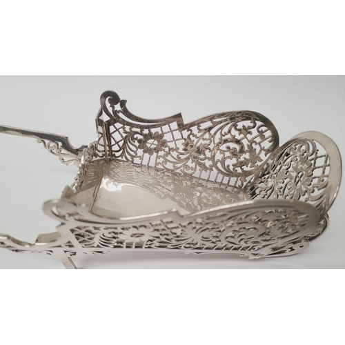 109 - A SOLID SILVER BEAUTIFULLY MADE FRETWORK DECORATED WHEEL BARROW DISH, beautifully made with scrollin... 