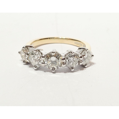 110 - A SPECTACULAR 18CT GOLD FIVE STONE GRADUATED DIAMOND RING, with a central diamond of .6cts, flanked ... 