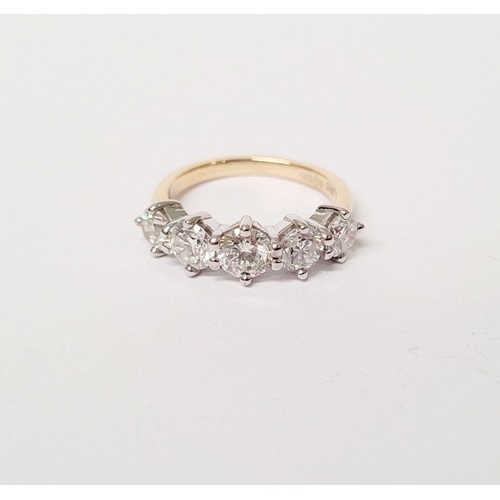 110 - A SPECTACULAR 18CT GOLD FIVE STONE GRADUATED DIAMOND RING, with a central diamond of .6cts, flanked ... 