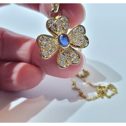 119 - A REALLY PRETTY SPARKLING 14 CT GOLD DIAMOND & BLUE SAPPHIRE PENDANT, on a 14ct gold delicate chain.... 