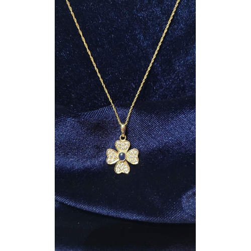 119 - A REALLY PRETTY SPARKLING 14 CT GOLD DIAMOND & BLUE SAPPHIRE PENDANT, on a 14ct gold delicate chain.... 