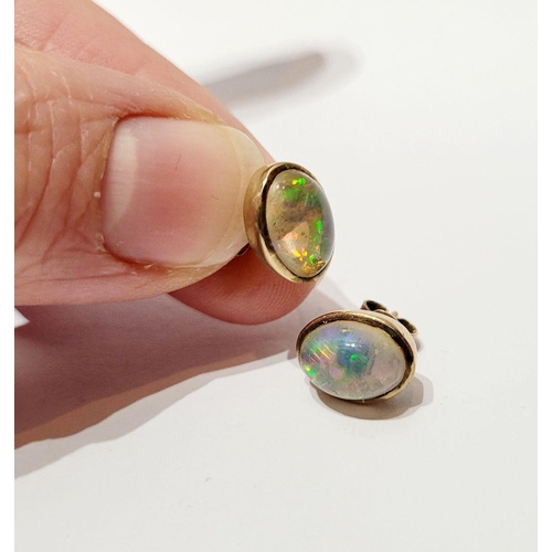 126 - A VINTAGE PAIR OF OVAL SHAPED BEZEL SET OPAL EARRINGS / STUDS, beautiful dynamic movement in the col... 