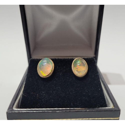 126 - A VINTAGE PAIR OF OVAL SHAPED BEZEL SET OPAL EARRINGS / STUDS, beautiful dynamic movement in the col... 