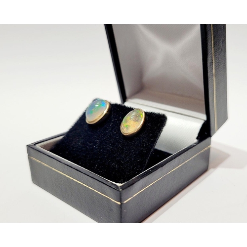 126 - A VINTAGE PAIR OF OVAL SHAPED BEZEL SET OPAL EARRINGS / STUDS, beautiful dynamic movement in the col... 