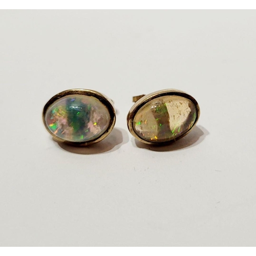 126 - A VINTAGE PAIR OF OVAL SHAPED BEZEL SET OPAL EARRINGS / STUDS, beautiful dynamic movement in the col... 