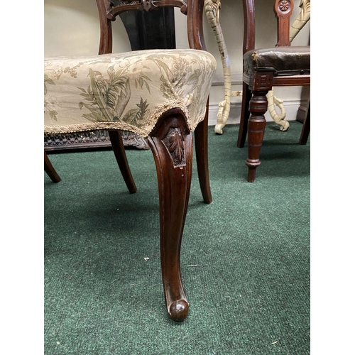 140 - A SET OF THREE EARLY VICTORIAN MAHOGANY DINING CHAIRS, the balloon back with foliate carvings above ... 