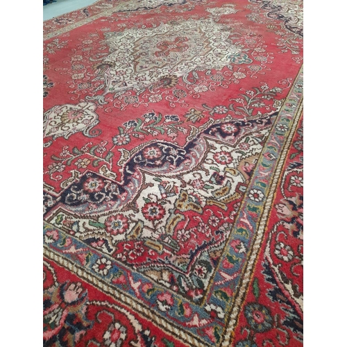 168 - AN EXCELLENT PERSIAN TABRIZ RUG, hand-knotted, featuring traditional Tabriz design with central meda... 