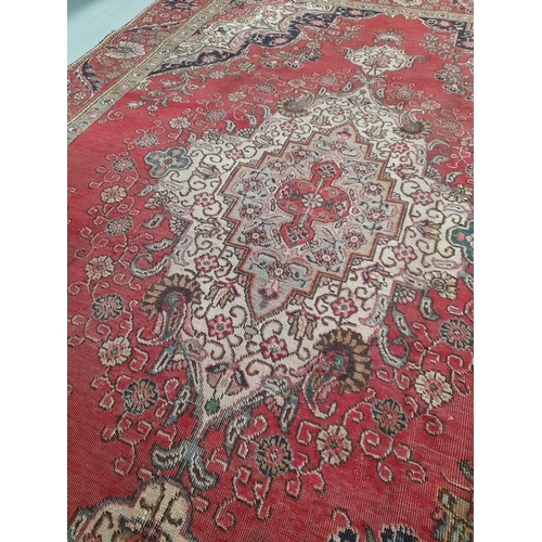 168 - AN EXCELLENT PERSIAN TABRIZ RUG, hand-knotted, featuring traditional Tabriz design with central meda... 