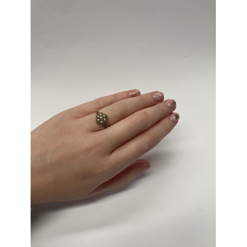 175 - A VERY NICE 9CT GOLD FLORAL PEARL CLUSTER RING, with central seeded pearl in claw setting surrounded... 