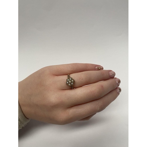 175 - A VERY NICE 9CT GOLD FLORAL PEARL CLUSTER RING, with central seeded pearl in claw setting surrounded... 