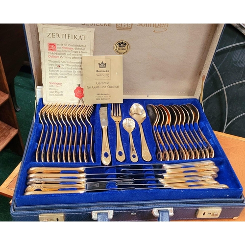 185 - AN SBS – BESTECKE SOLINGEN 23/24 KARAT 70 PIECE CASED CUTLER SET, hartvergoldet 23/24 – hard gold pl... 