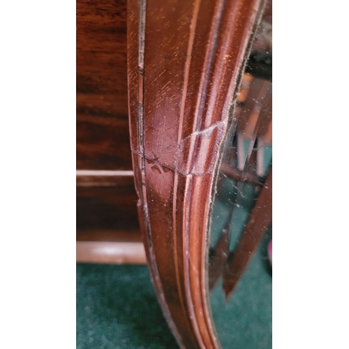 187 - A MAHOGANY INALID OVAL SHAPED BEVELLED WALL MIRROR, very heavy with a panelled wooden back. Frame ha... 