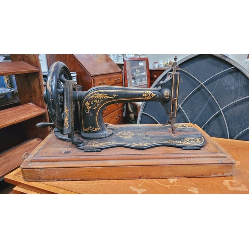 188 - A 19TH CENTURY HAND-CRANK FIDDLE-BASE SINGER SEWING MACHINE, a beautiful piece of antique machinery;... 