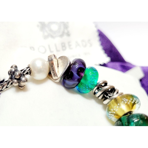 192 - A FANTASTIC TROLLBEADS STERLING SILVER BRACELET WITH CHARMS, presented in original box on a soft rib... 