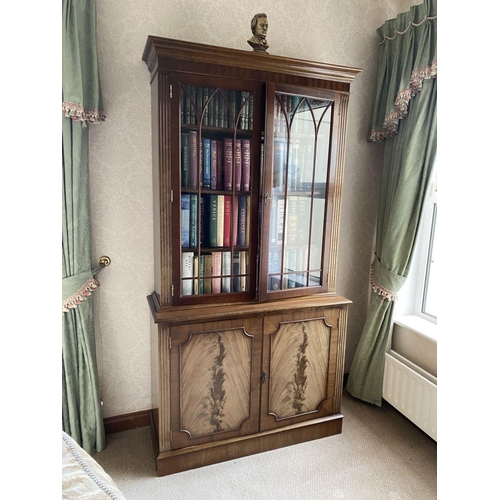 21 - AN EXCELLENT FLAME MAHOGANY LIBRARY BOOKCASE, with cornice above two large glazed doors with three s... 