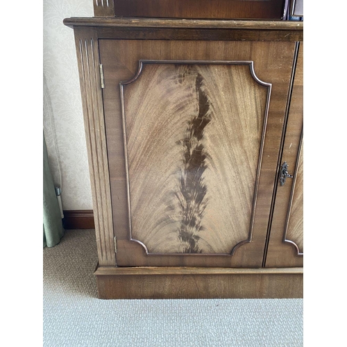 21 - AN EXCELLENT FLAME MAHOGANY LIBRARY BOOKCASE, with cornice above two large glazed doors with three s... 