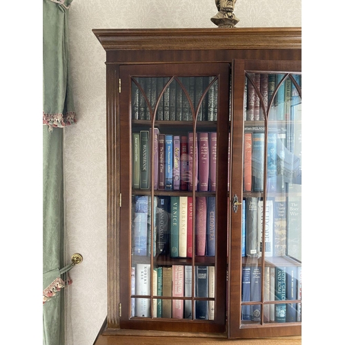 21 - AN EXCELLENT FLAME MAHOGANY LIBRARY BOOKCASE, with cornice above two large glazed doors with three s... 