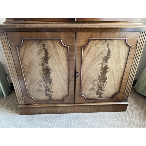 21 - AN EXCELLENT FLAME MAHOGANY LIBRARY BOOKCASE, with cornice above two large glazed doors with three s... 