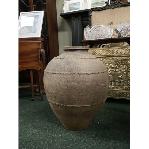 210 - AN ANTIQUE HEAVY TERRACOTTA POT/PLANTER, the bulbous body decorated with thumb-moulded rings, dimens... 