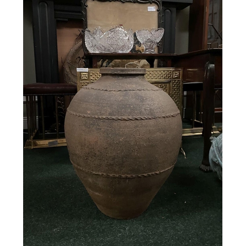 210 - AN ANTIQUE HEAVY TERRACOTTA POT/PLANTER, the bulbous body decorated with thumb-moulded rings, dimens... 