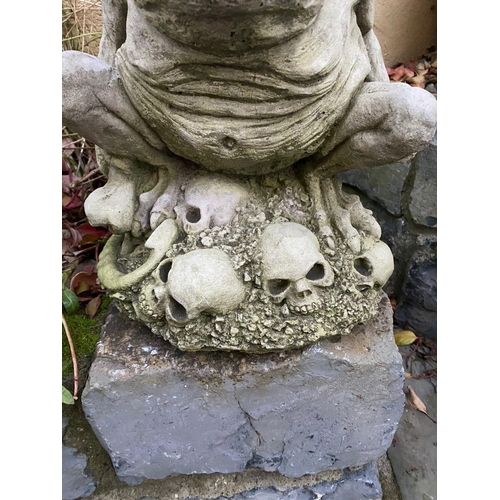 221 - A GARDEN ORNAMENT IN THE FORM OF LITTLE SEATED GARGOYLE FIGURE, 34cm tall.