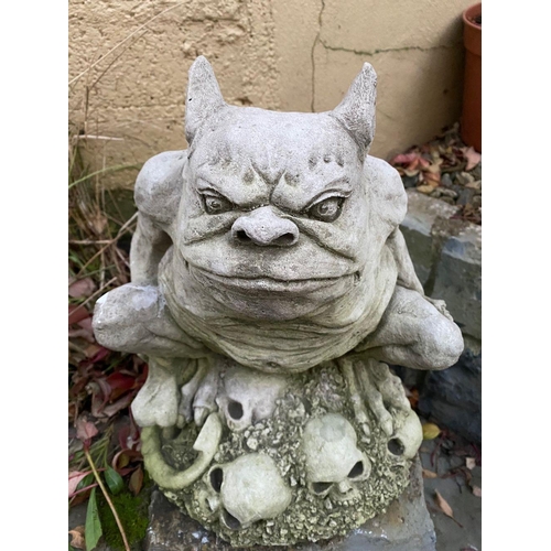 221 - A GARDEN ORNAMENT IN THE FORM OF LITTLE SEATED GARGOYLE FIGURE, 34cm tall.