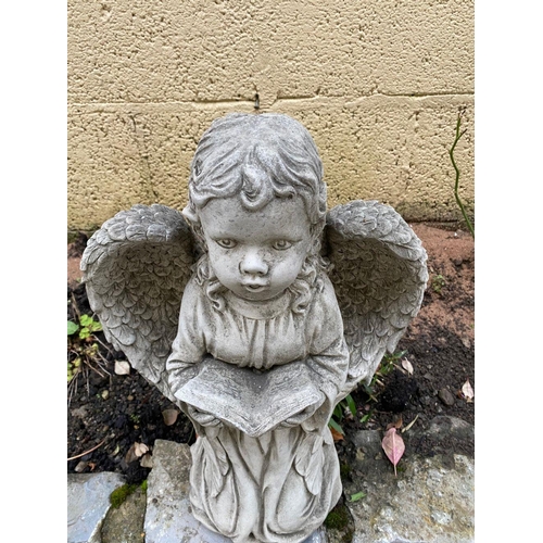 226 - A GARDEN ORNAMENT IN THE FORM OF A SMALL ANGEL LIKE FIGURE, knelling holding a book in their hands a... 