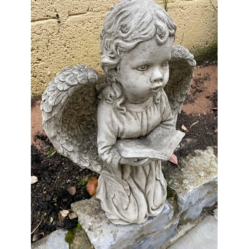 226 - A GARDEN ORNAMENT IN THE FORM OF A SMALL ANGEL LIKE FIGURE, knelling holding a book in their hands a... 