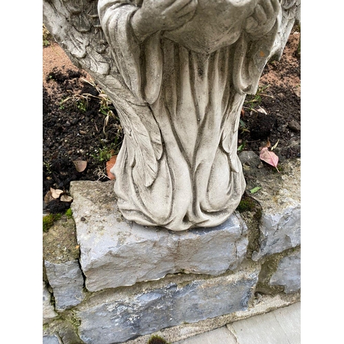 226 - A GARDEN ORNAMENT IN THE FORM OF A SMALL ANGEL LIKE FIGURE, knelling holding a book in their hands a... 