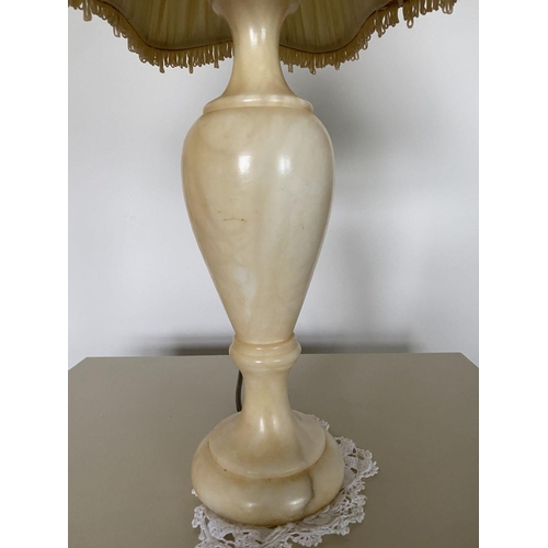 229 - A LOVELY PAIR OF MARBLE TABLE LAMPS, with bulbous support on circular platform base, complete with l... 