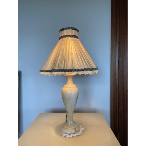 229 - A LOVELY PAIR OF MARBLE TABLE LAMPS, with bulbous support on circular platform base, complete with l... 