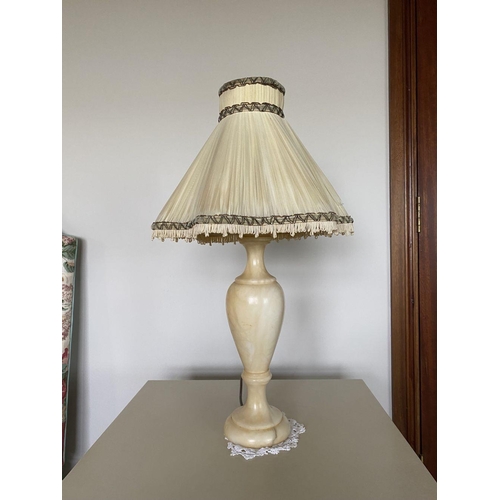 229 - A LOVELY PAIR OF MARBLE TABLE LAMPS, with bulbous support on circular platform base, complete with l... 